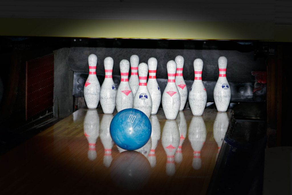 Bowling Ball, Bowling Shoes And Bowling Pins Side By Side by