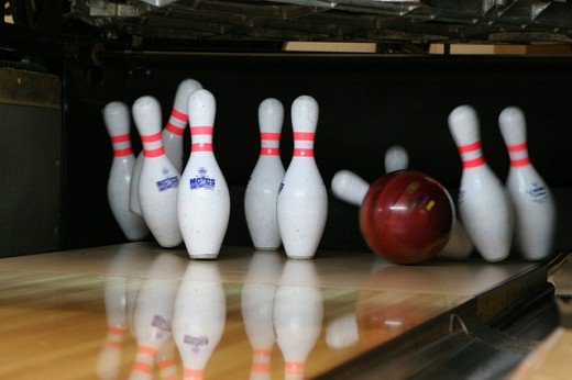 bowling ball hitting pins strike
